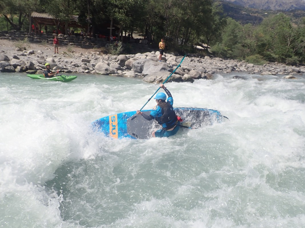 A picture containing outdoor, water, surfing, water sportDescription automatically generated