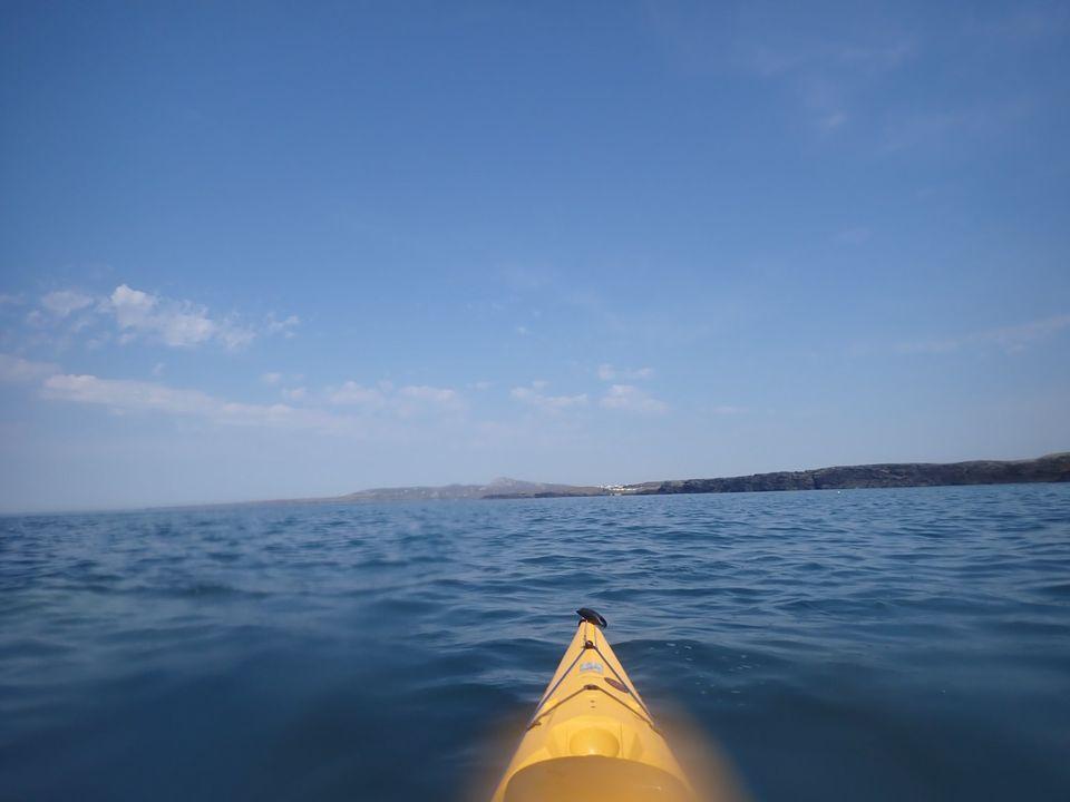A yellow kayak on the water

Description automatically generated with low confidence