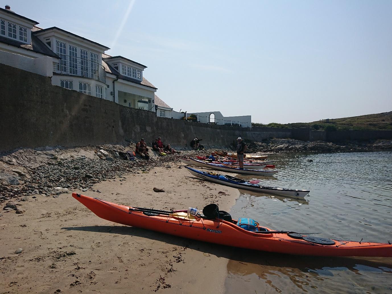 Boats on a beachDescription automatically generated with low confidence