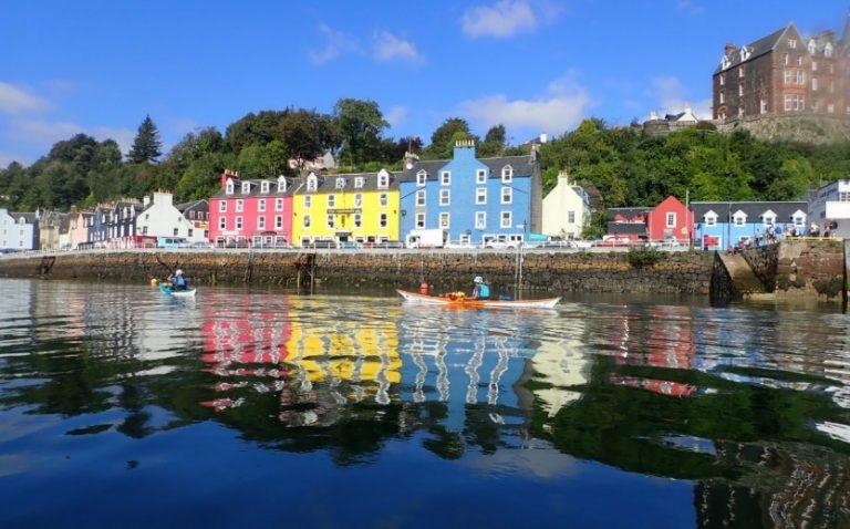 A body of water with buildings along it Description automatically generated with medium confidence