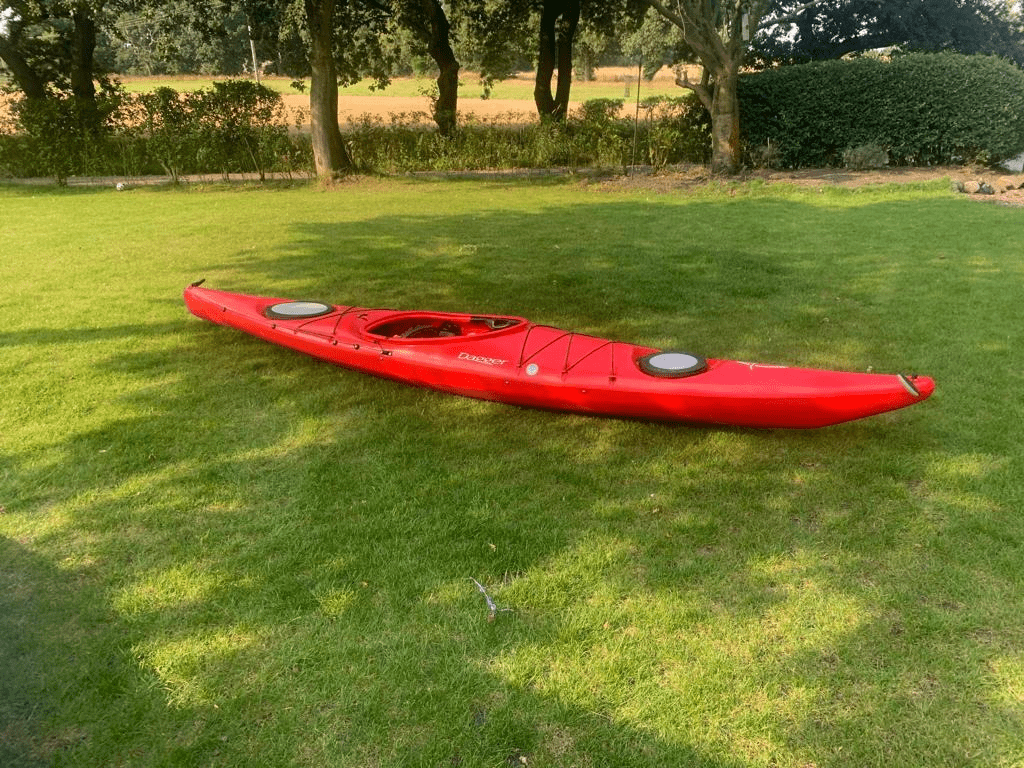 A picture containing grass, outdoor, tree, redDescription automatically generated