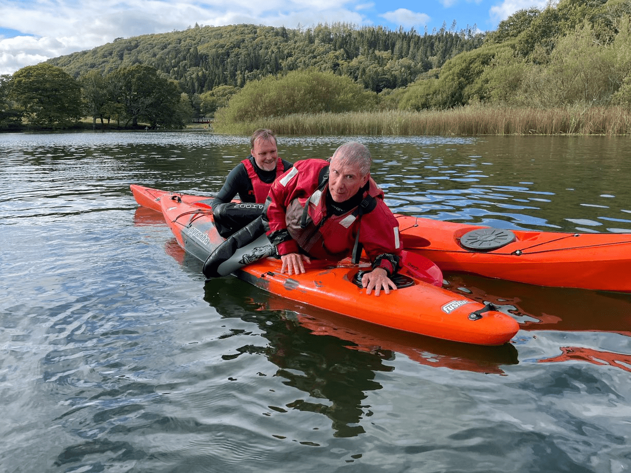 A picture containing water, outdoor, orange, ridingDescription automatically generated