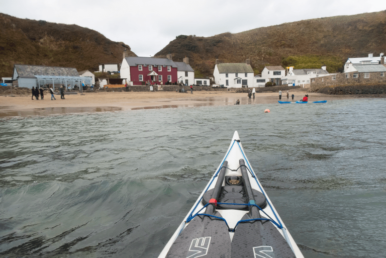 A sailboat in the water Description automatically generated with low confidence