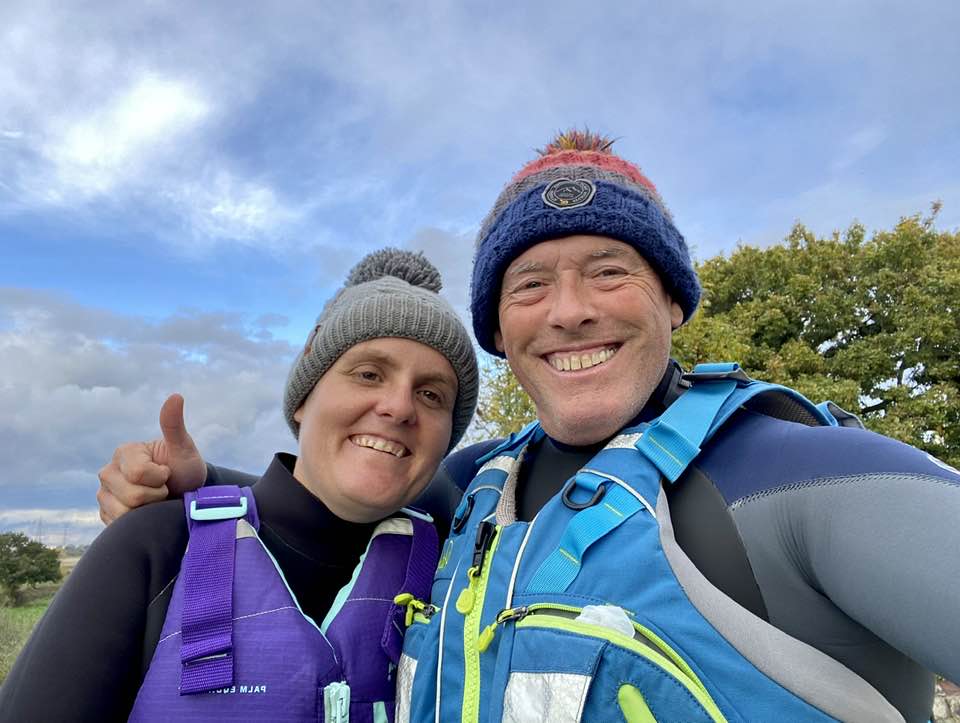 May be an image of 2 people, people standing and body of water
