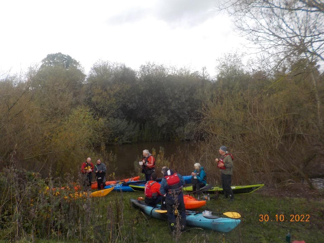 A group of people in kayaksDescription automatically generated with medium confidence