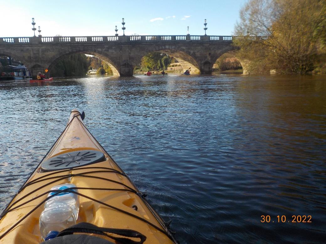 A kayak on a riverDescription automatically generated with low confidence