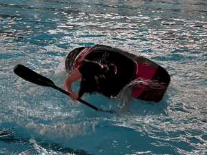 A person swimming in water Description automatically generated with low confidence