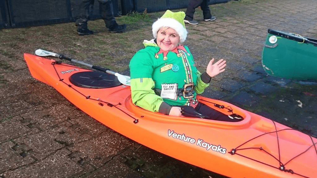 A picture containing grass, outdoor, orange, transportDescription automatically generated