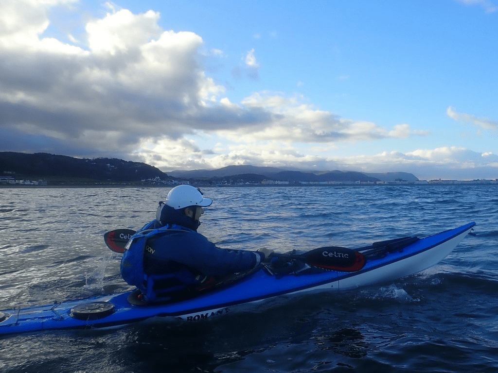 A person in a kayakDescription automatically generated with low confidence