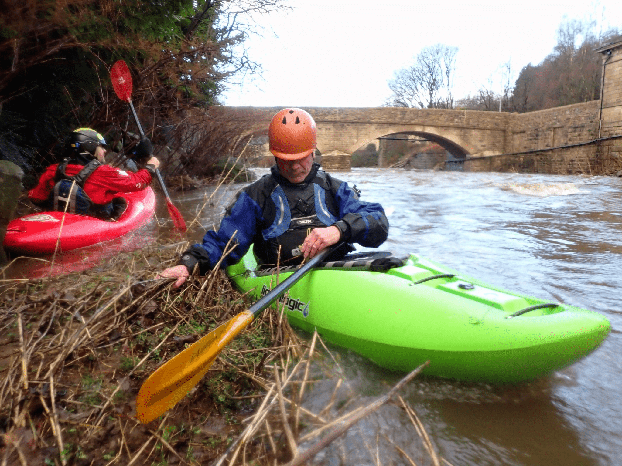 A person in a kayak in a riverDescription automatically generated with low confidence