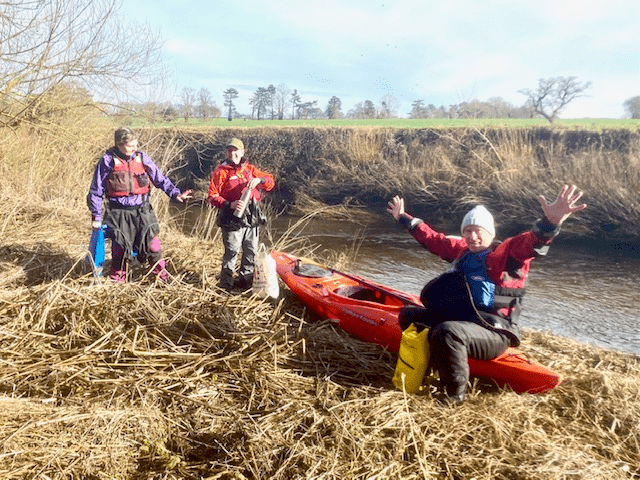A group of people in a fieldDescription automatically generated with low confidence