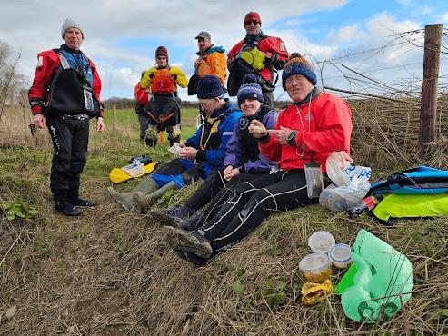 A group of people outsideDescription automatically generated with low confidence