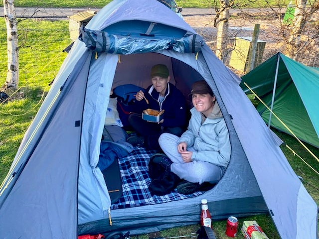 A group of people in a tent
Description automatically generated with medium confidence