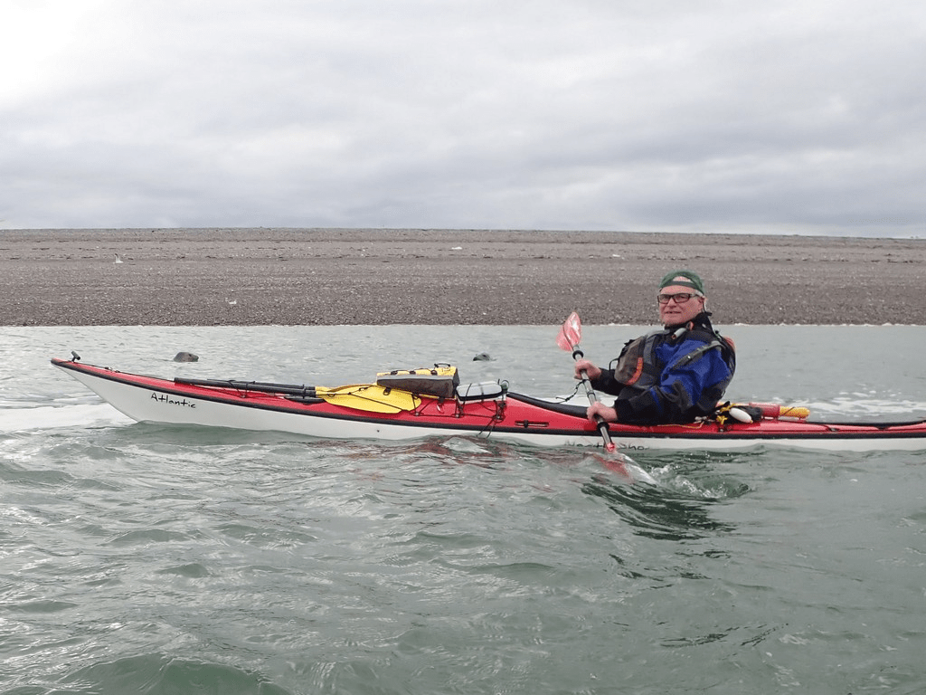A person in a kayak with a dog in it

Description automatically generated with low confidence