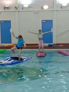 a-picture-containing-child-swimming-water-sport A picture containing child, swimming, water sport Description automatically generated