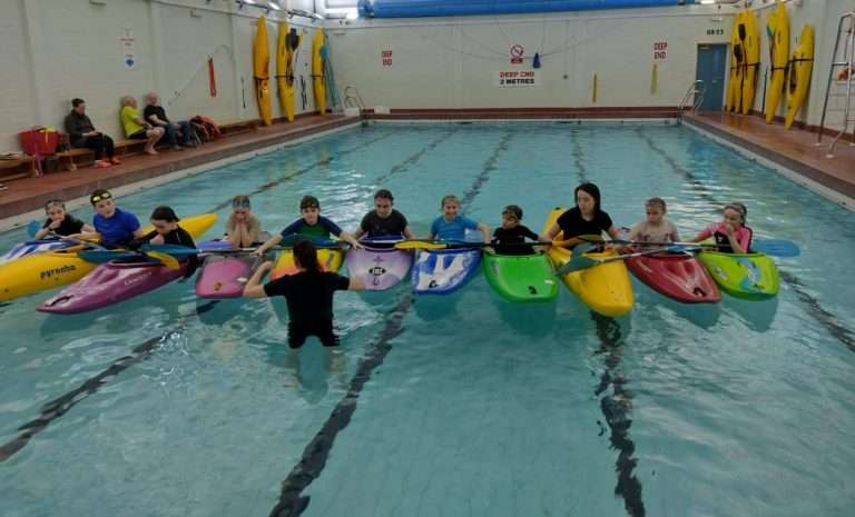 A picture containing indoor, swimming, water sport, sport Description automatically generated