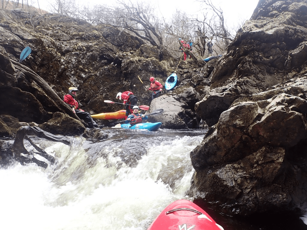 A picture containing outdoor, mountain, rock, raftDescription automatically generated