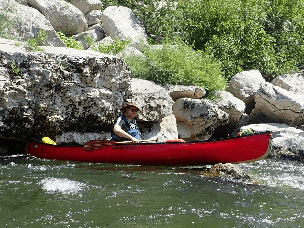 a momentary loss of concentration Martin managed to lodge his canoe across the only gap in the river