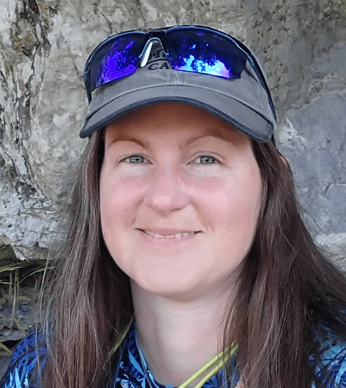 A person wearing a hat and sunglassesDescription automatically generated with medium confidence