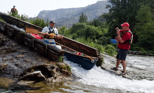 A picture containing outdoor, outdoor recreation, watercraft, tree Description automatically generated