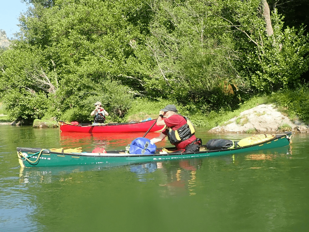 A picture containing outdoor, watercraft, transport, treeDescription automatically generated