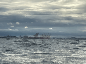 A body of water with a large building in the distance Description automatically generated