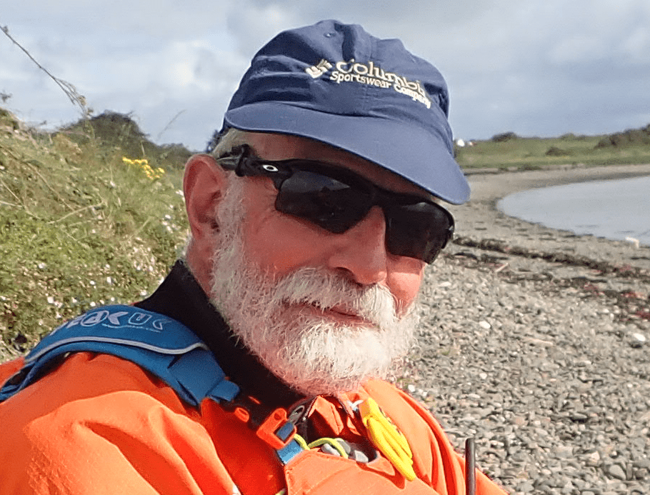 A person wearing sunglasses and a hatDescription automatically generated