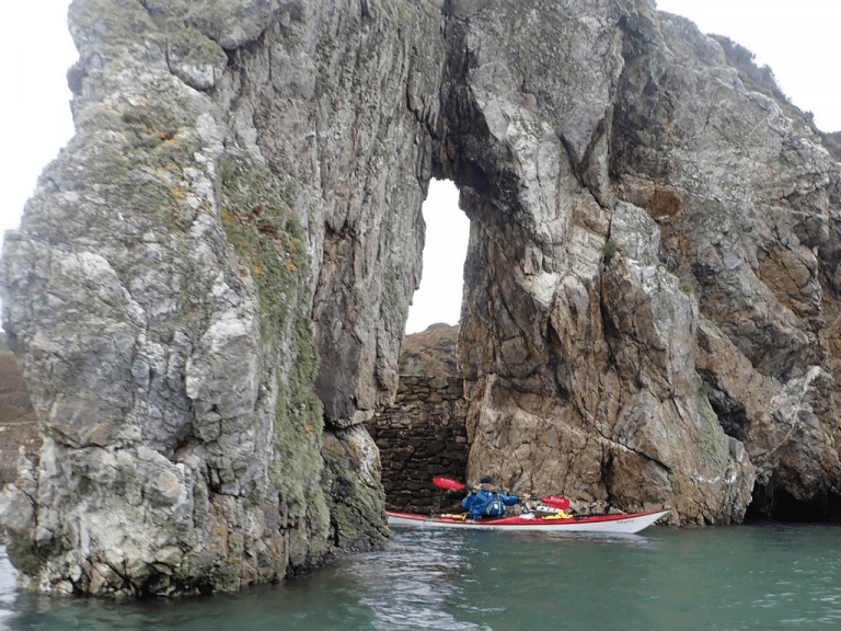 A boat in a cave Description automatically generated