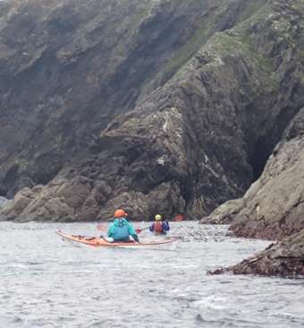 People kayaking in the waterDescription automatically generated