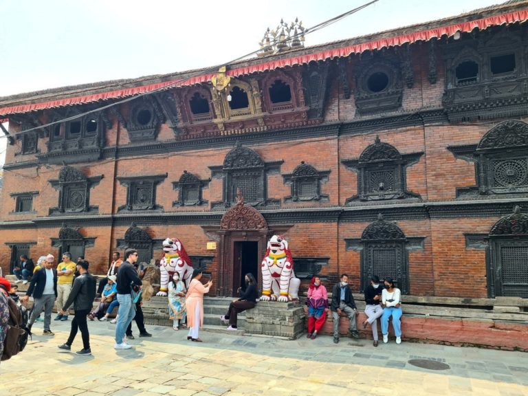 A group of people outside of a building Description automatically generated