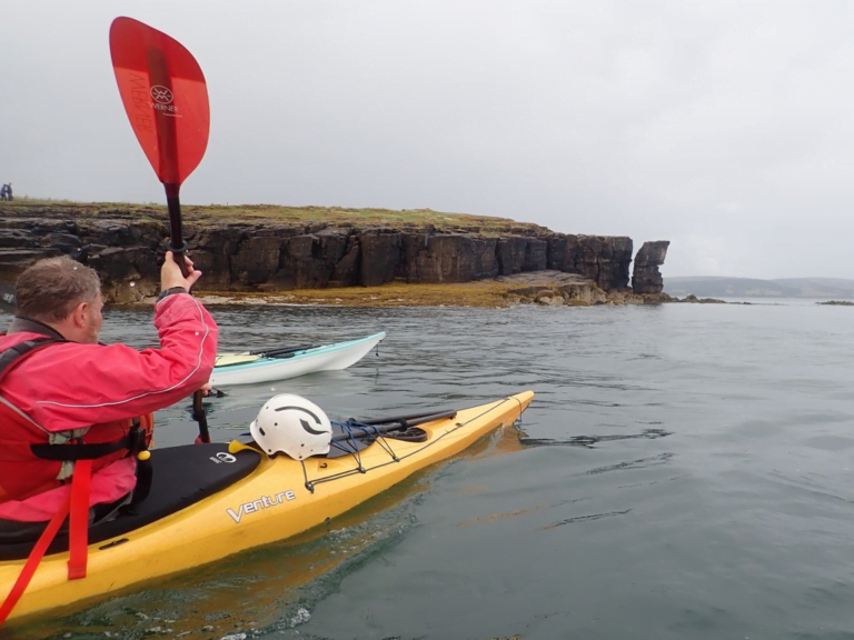 A person in a kayak Description automatically generated