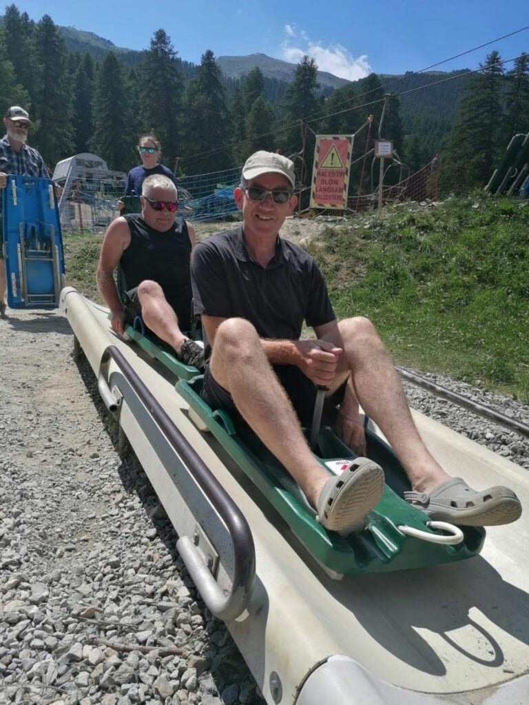 A person on a sled Description automatically generated