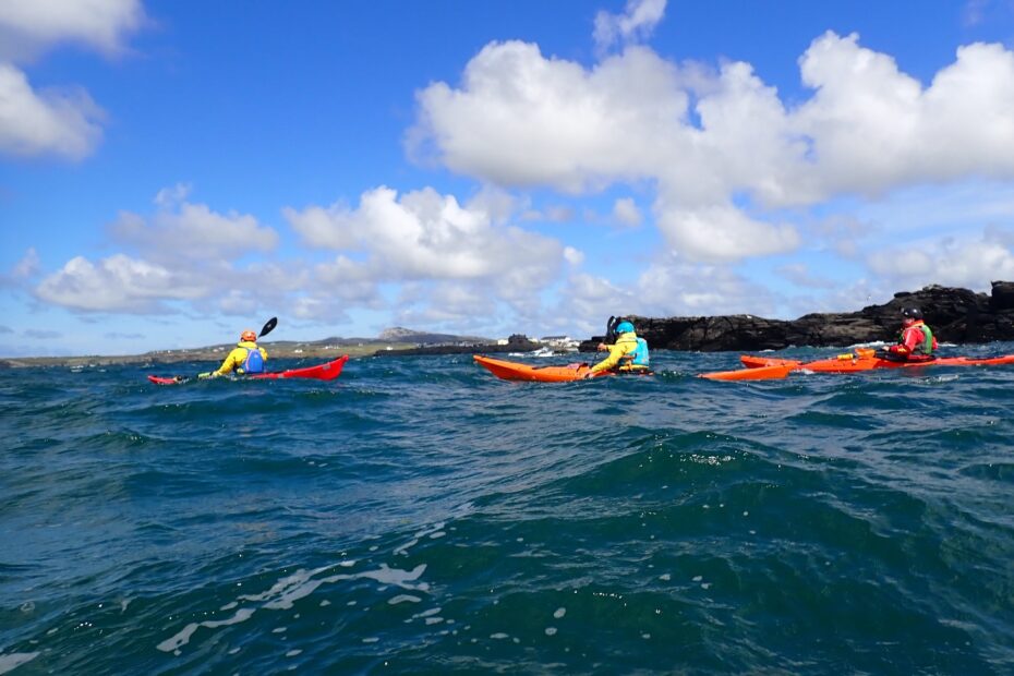 People kayaking in the water Description automatically generated