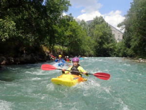 A group of people in a kayak Description automatically generated
