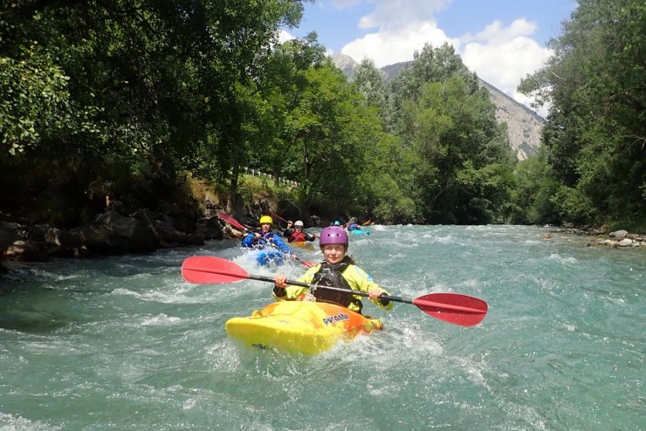 A group of people in a kayak Description automatically generated