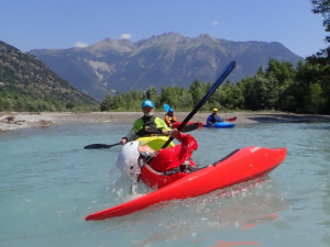 A group of people in a kayak Description automatically generated