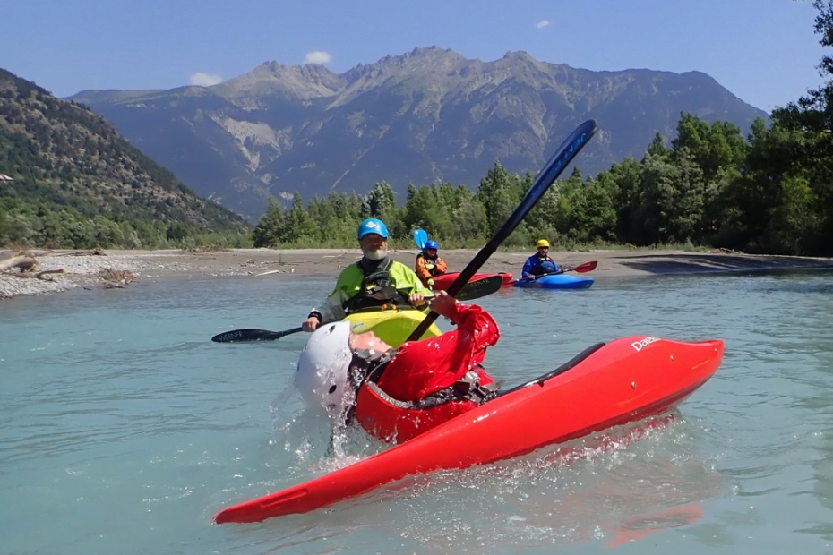 A group of people in a kayak Description automatically generated