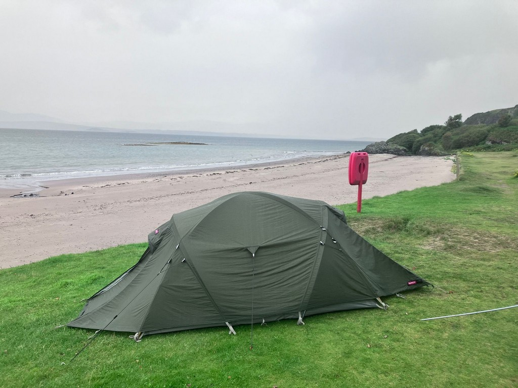 A tent on the grassDescription automatically generated