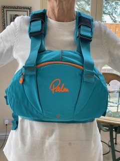 A person wearing a blue bag Description automatically generated