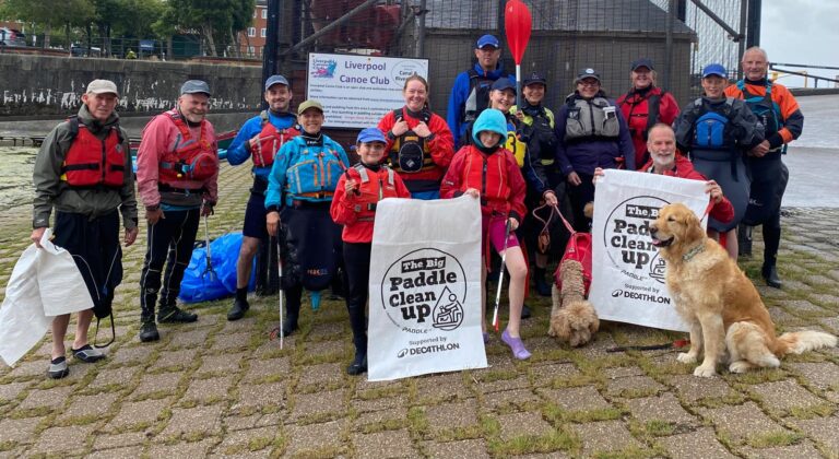 A group of people holding signs AI-generated content may be incorrect.