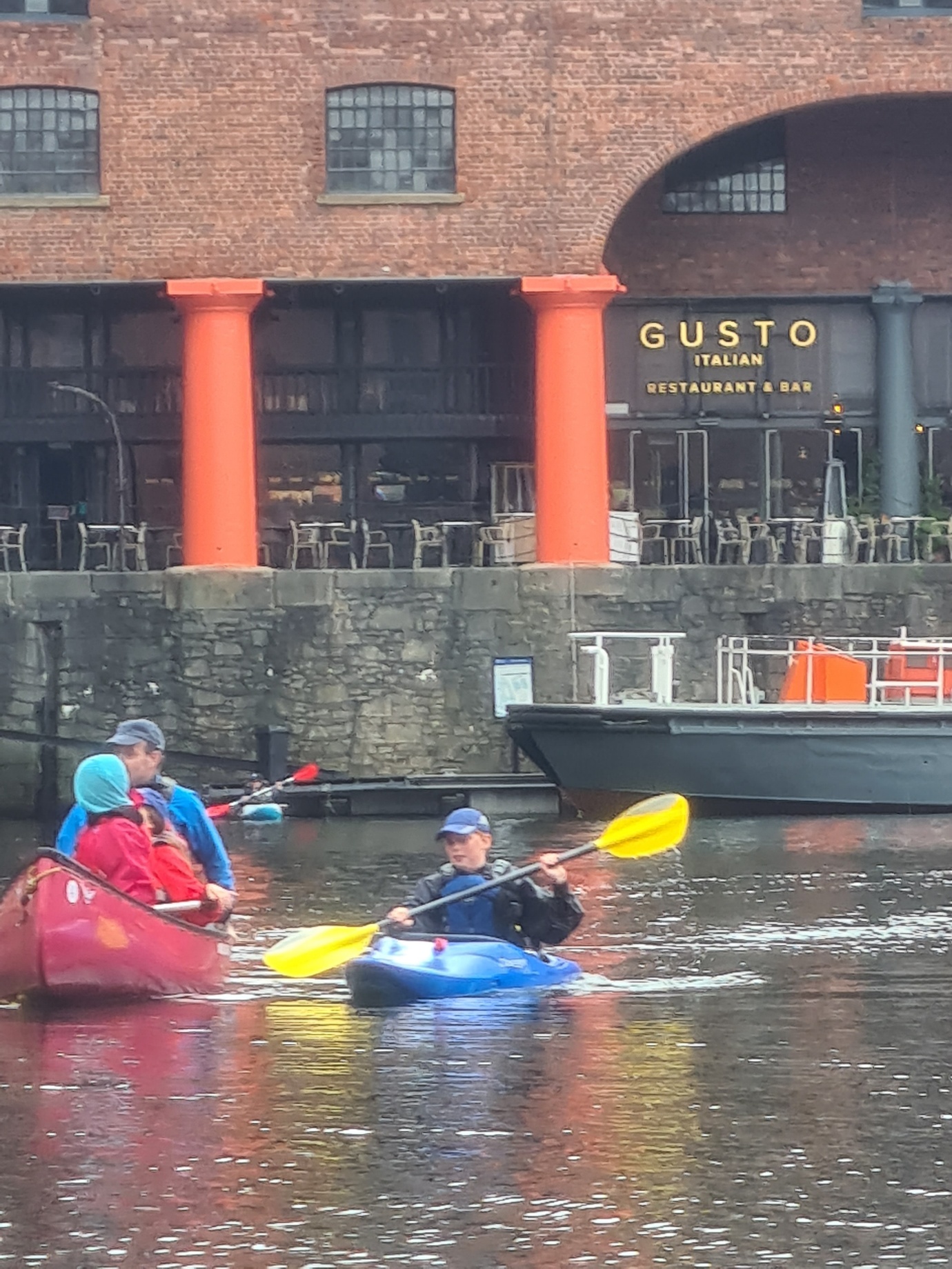 People in a canoeAI-generated content may be incorrect.