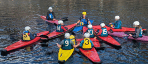 A group of people in kayaks on water AI-generated content may be incorrect.