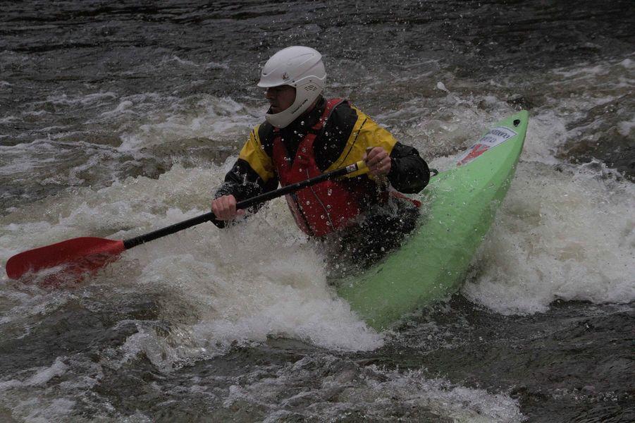 A person kayaking in a river

Description automatically generated with medium confidence