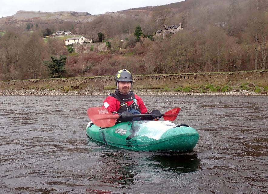 A person in a kayak on a river

Description automatically generated with medium confidence