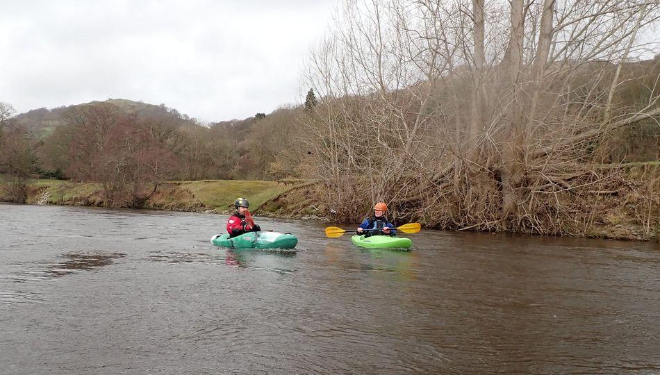Two people in kayaks on a river

Description automatically generated with medium confidence