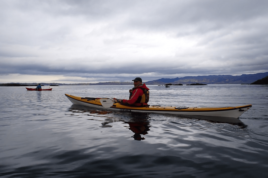 A person in a canoe Description automatically generated with low confidence