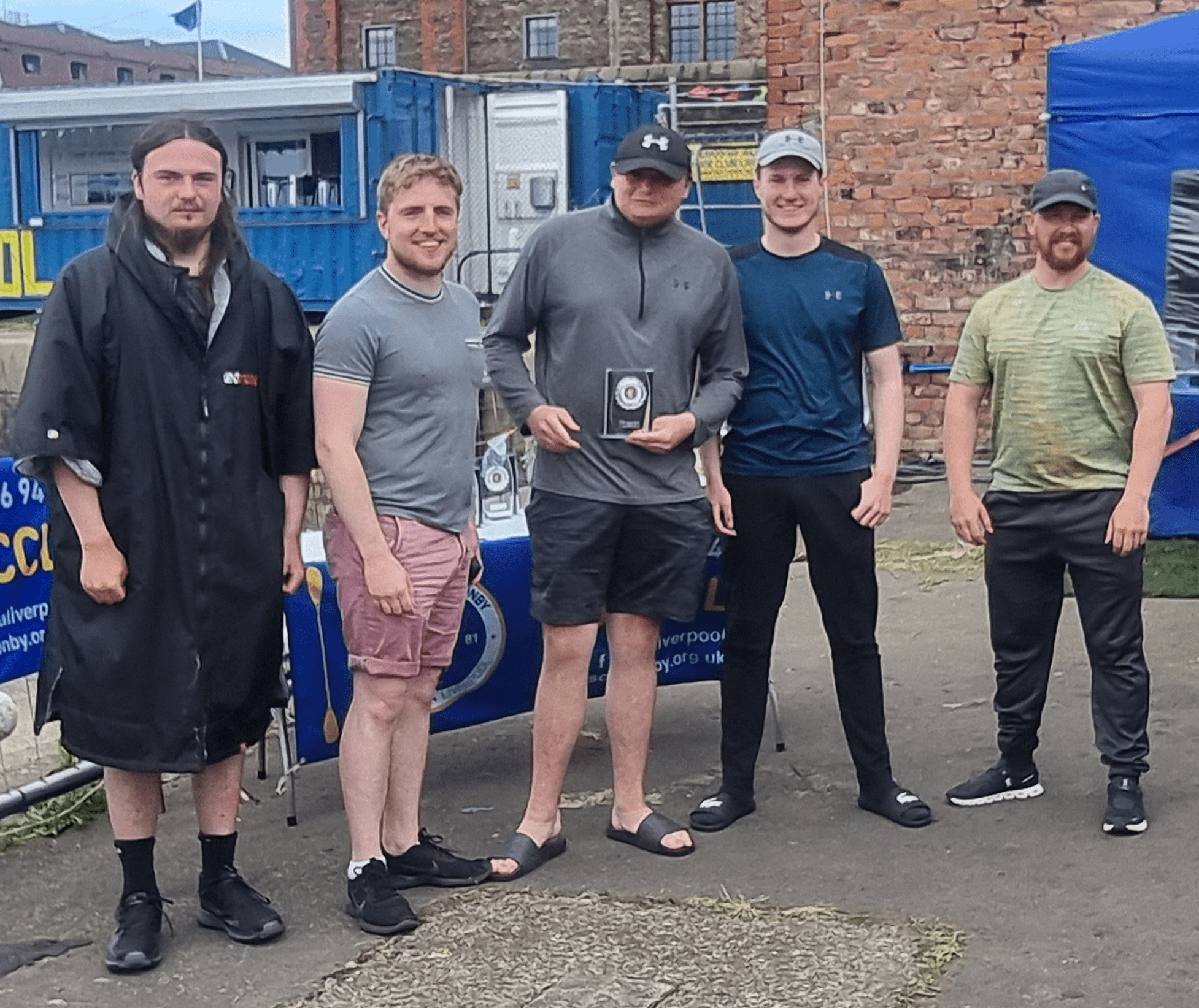 A group of men standing outside

Description automatically generated with low confidence