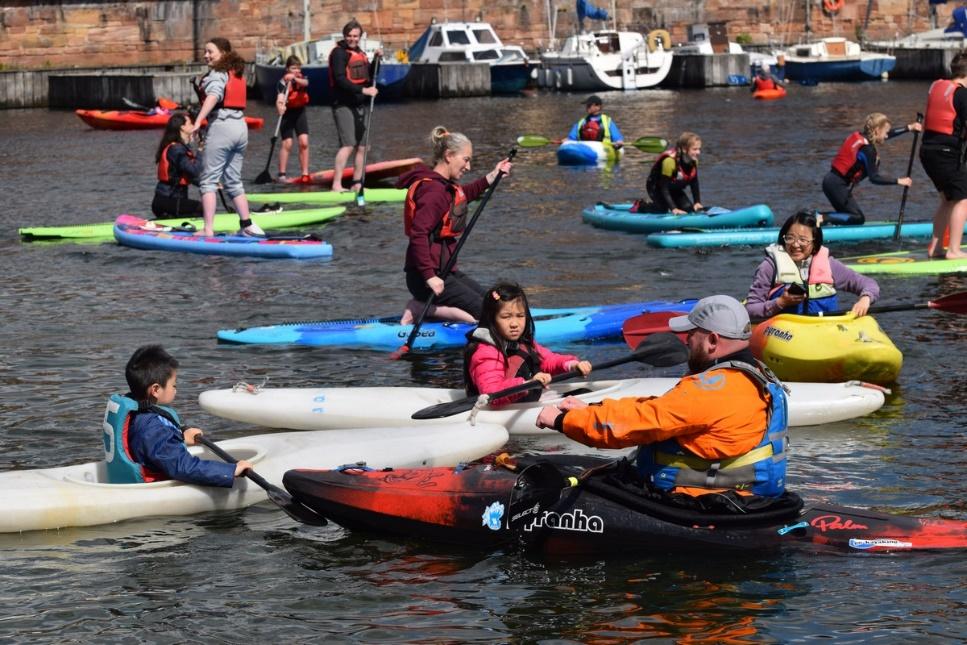 A group of people in kayaks

Description automatically generated with low confidence