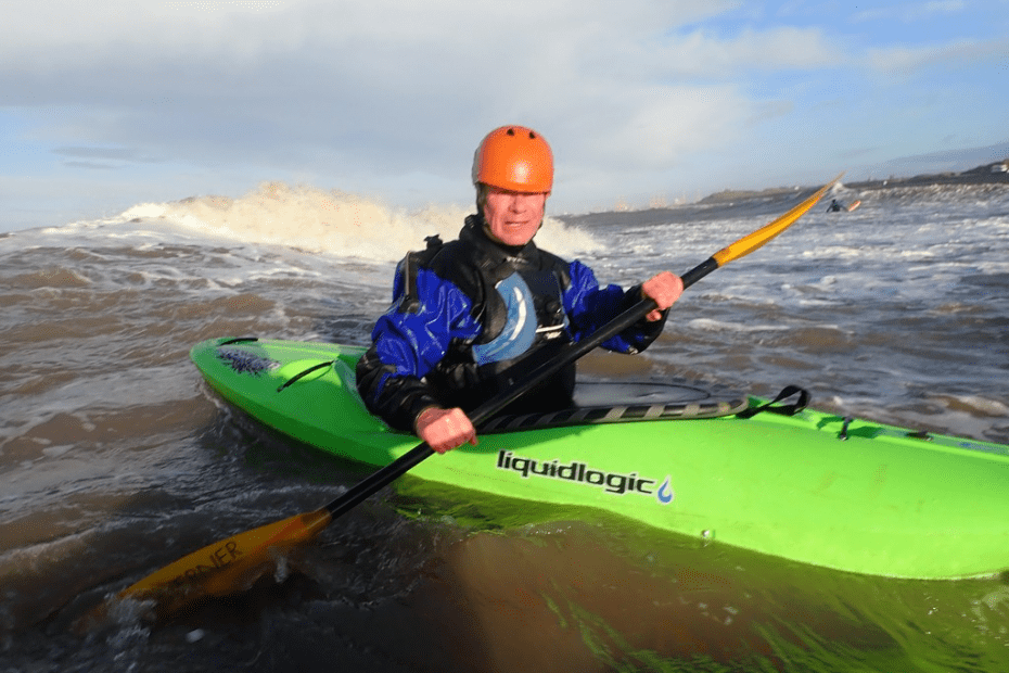 A person in a kayak Description automatically generated with medium confidence