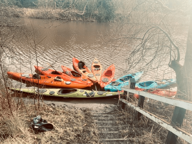 A picture containing outdoor, orange, boat, raft Description automatically generated